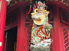 11B Statue of the heavenly king of the east holds a pipa lute Yue Heung Shrine at Wong Tai Sin temple Hong Kong